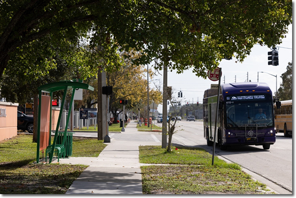 Photo of bus approaching and empty bus stop