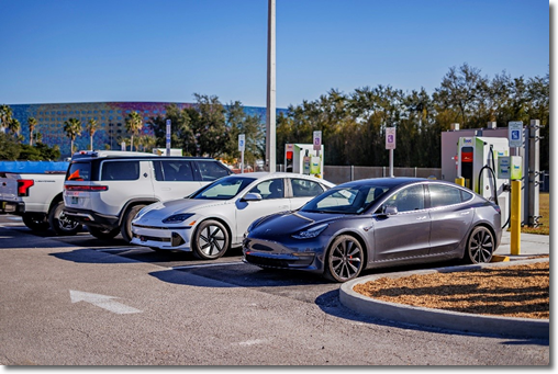 Photo of 4 electric vehicles charging at a charging station